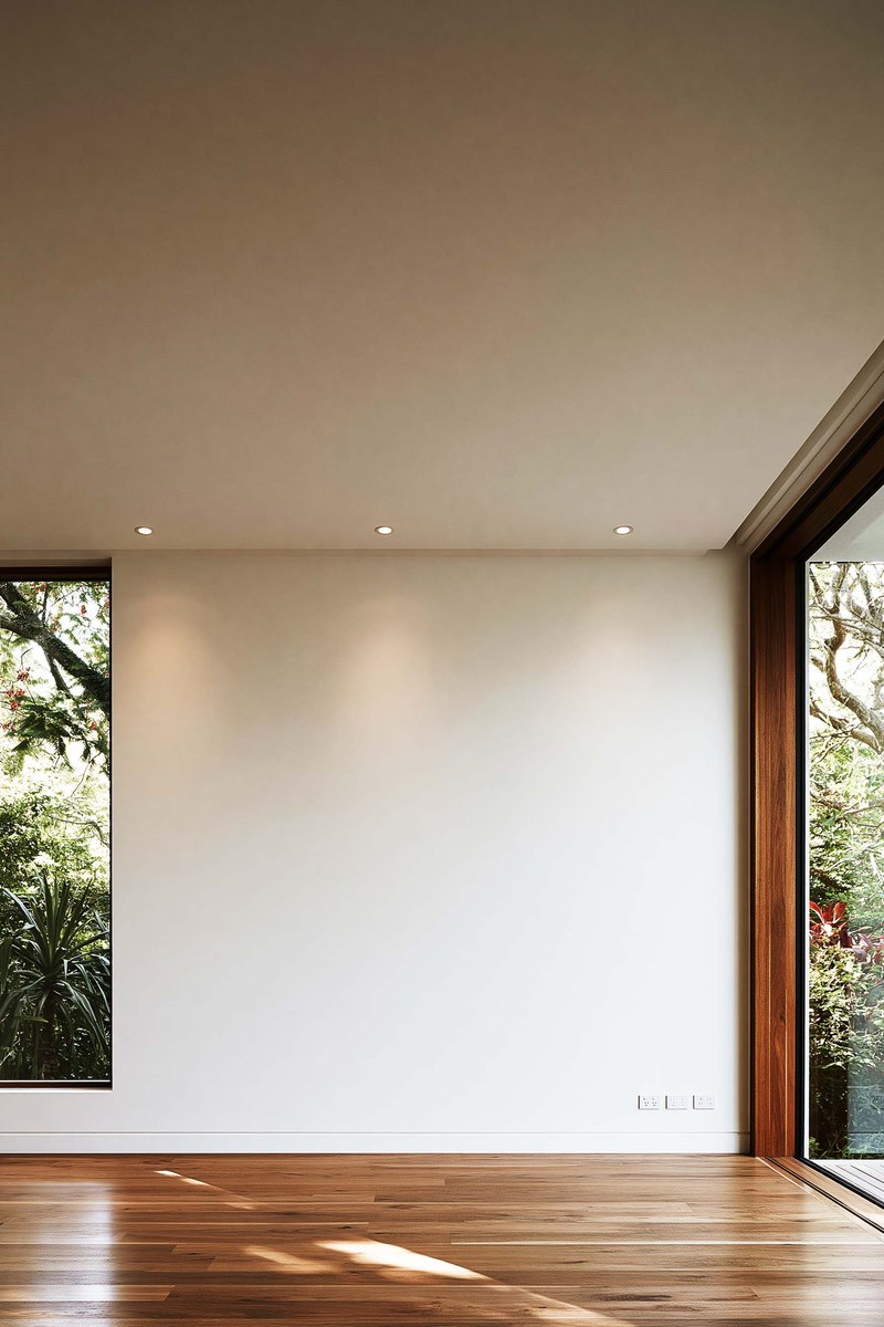 Flat white ceiling meeting the wall at a soffit, lit from one side