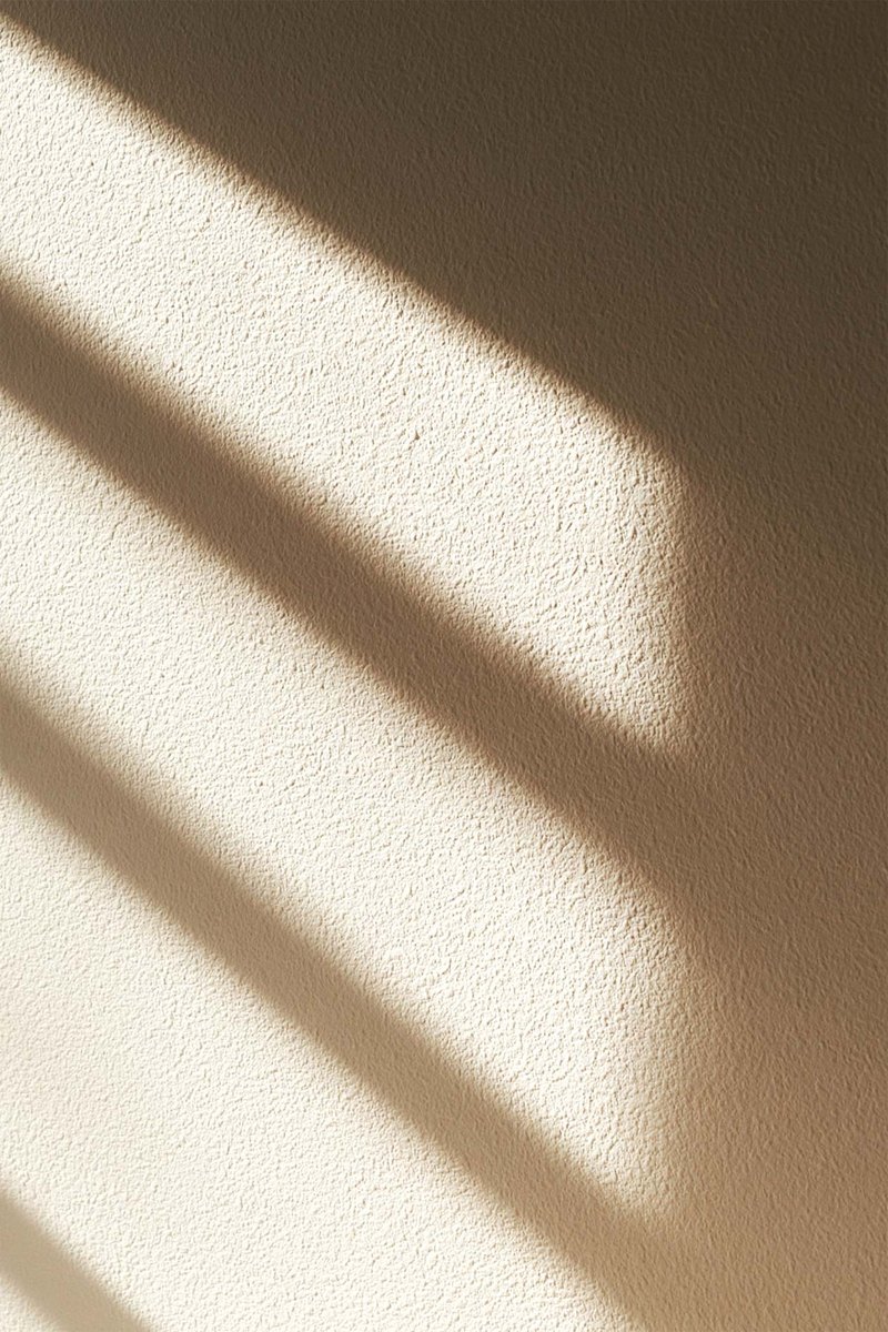 Textured wall surface with light skimming across it
